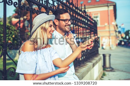 Young couple at the meeting. Romantic couple take a rest after shopping. Love, dating, romance Royalty-Free Stock Photo #1339208720