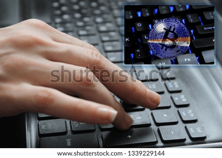 Hand of the girl on the keyboard close up with the concept of digital technology on the purchase and sale of crypto currency bitcoin with a flag of Marshall Islands. The concept of network