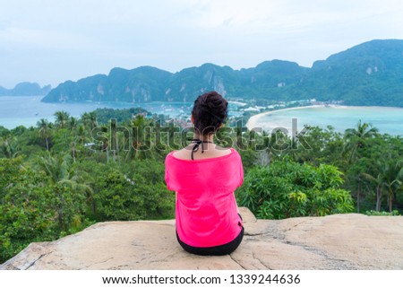 happy young cute girl relaxing woman resting women hipster guiding 
female travelling planning stuff long weekend idea at beautiful blue 
paradise tropical coast beach PP Island Krabi Phuket Thailand
