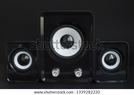 sound speakers with free space between them on black background.