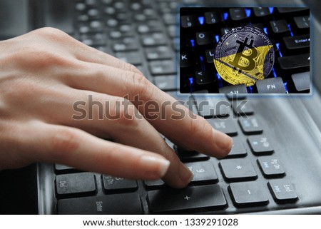 Hand of the girl on the keyboard close up with the concept of digital technology on the purchase and sale of crypto currency bitcoin with a flag of Tokelau. The concept of network, communication
