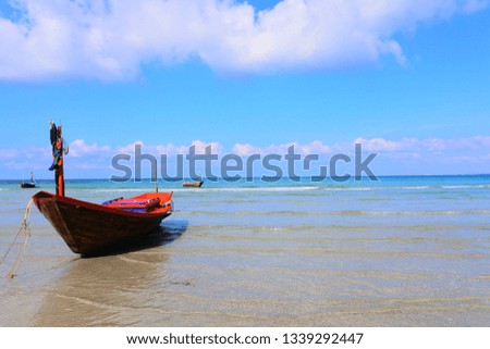Sea, beach, fishing boat in the sea