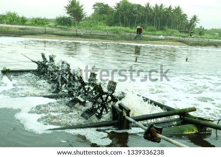 Tambak Udang, Lobster Farm using waterwheel to move the water inside the pool. 