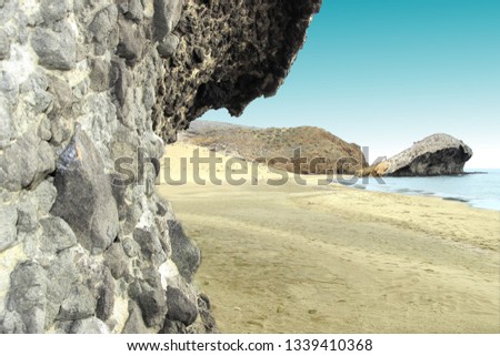 indiana Jones movie stage and the last crusade, tongues of lava eroded by the sea, the auto clastic gaps or pyroclastic andesite, The petrified wave, beach of Mónsul, Natural Park, Cabo de Gata, spain Royalty-Free Stock Photo #1339410368