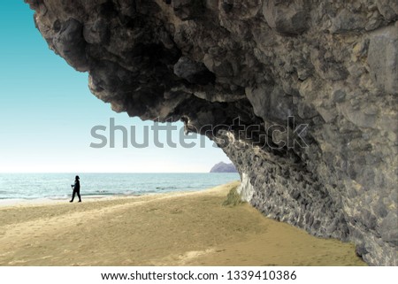 indiana Jones movie stage and the last crusade, tongues of lava eroded by the sea, the auto clastic gaps or pyroclastic andesite, The petrified wave, beach of Mónsul, Natural Park, Cabo de Gata, spain Royalty-Free Stock Photo #1339410386