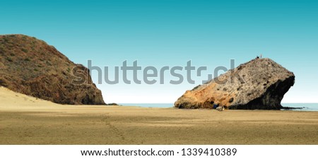 indiana Jones movie stage and the last crusade, tongues of lava eroded by the sea, the auto clastic gaps or pyroclastic andesite, The petrified wave, beach of Mónsul, Natural Park, Cabo de Gata, spain Royalty-Free Stock Photo #1339410389