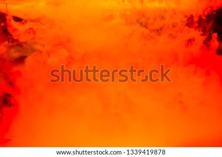 Color paint drops in water. Ink swirling underwater. Cloud of silky ink collision on black background. Colorful abstract smoke explosion animation. Close up camera view.
