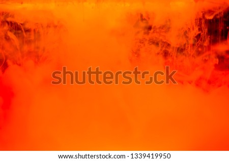 Color paint drops in water. Ink swirling underwater. Cloud of silky ink collision on black background. Colorful abstract smoke explosion animation. Close up camera view.