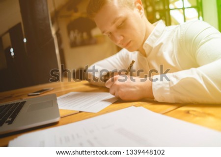 close up office worker hold pen and sign documents or a contract