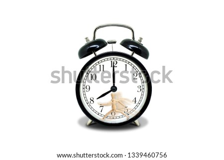 Time Management Concept : Wooden figure mannequin running on retro black alarm clock that showing eight o'clock.