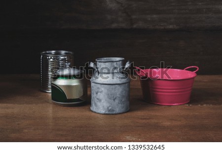 Still life Tin can on wood table background.