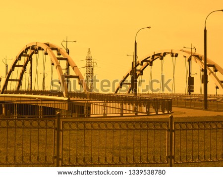 bridge construction across a river, yellow photo processing