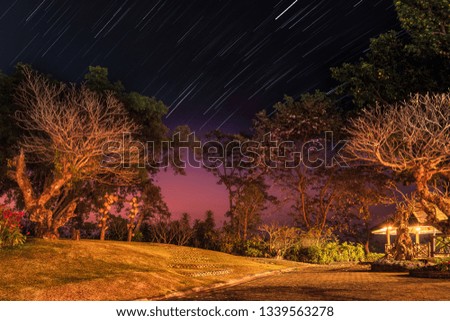 Star trails at twilight over Doi Tung, Chiangrai, Thailand.