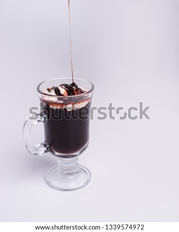 cup with hot chocolate over grey background