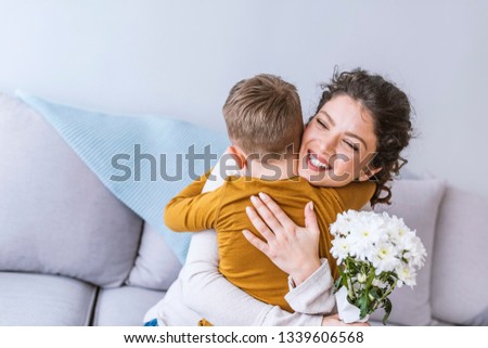 Little and Mother Happy Together. Boy Gift Mother Flowers. Love with Mother and Son. Care Boy with Mom. Romantic Day Happiness and Mother Happy that Gift Flowers. Happy Holiday 8 Marth.