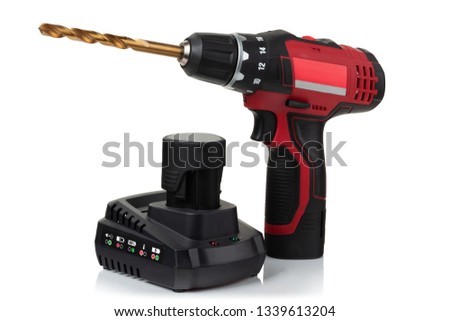 modern compact cordless screwdriver, drill with drill and charger with battery on white background