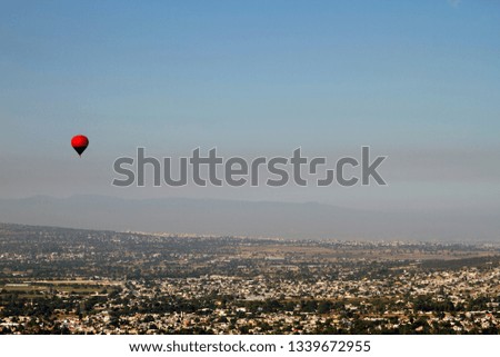 Panoramic view concept. Hot air balloon flying over Mexico city. 