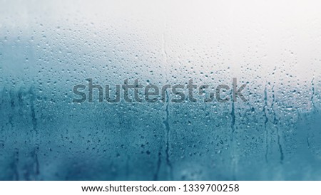 Detail of moisture condensation problems, hot water vapor condensed on the cold glass close up Royalty-Free Stock Photo #1339700258