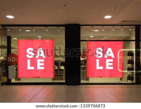 sales sign fifty percent off sign on a store front