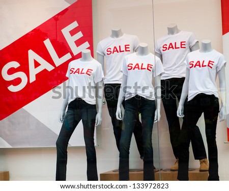 window display with text SALE in a shop