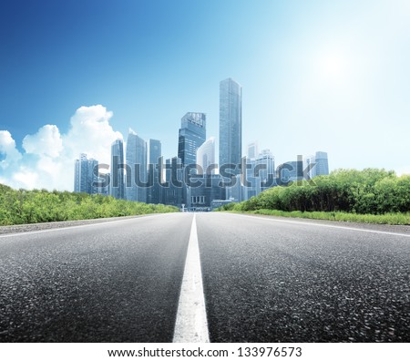 Asphalt road and modern city