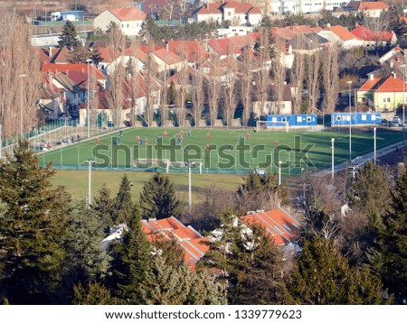 Soccer match played on an outdoor grass field in Sopron, Hungary