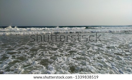 
Sea waves overlooking the sandy coast of the China Sea