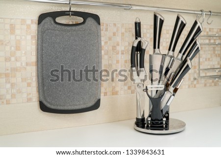 Set of six kitchen knives on a modern kitchen