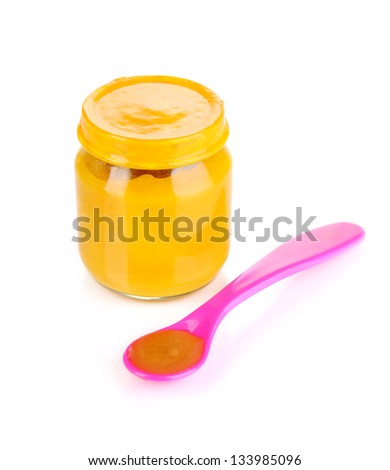 Baby food with weaning spoon isolated on white