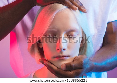 albino girl with white eyelashes getting medical treatment. hypnosis concept. hypnotic girl , close up photo