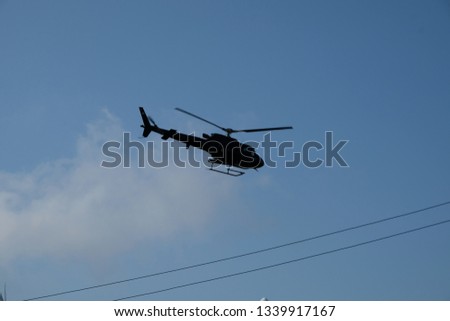 a helicopter in blue sky