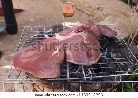 Different types of meat  And liver are cooked on the grill - close up In rural Morocco Fez