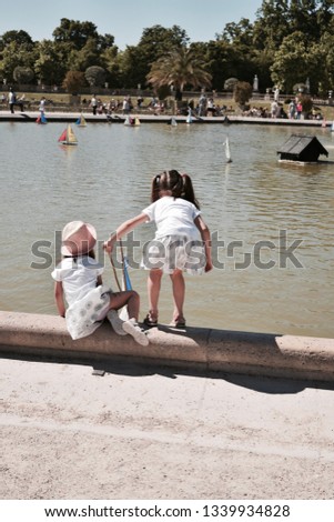 French Children with Pond
 Royalty-Free Stock Photo #1339934828