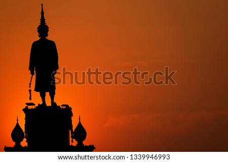 Silhouette of king Narai the Great  golden sky background