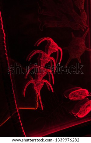 Abstract picture on the theme of the underwater world with red figures