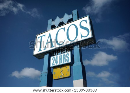  Aged and worn vintage tacos sign                              