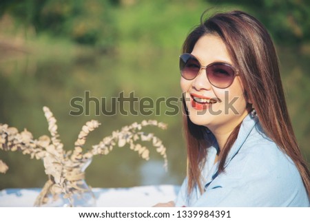 Outdoor portrait asian woman standing near to local river in Chiang Mai Thailand
