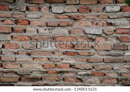 old red bricks wall fragment texture and vintage background 