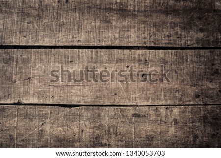 weathered wood plank table and wall with dark grunge style Royalty-Free Stock Photo #1340053703