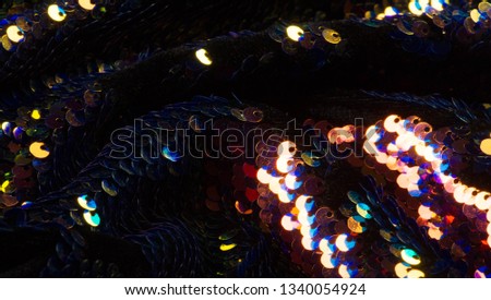 pattern background texture fabric with sequins Die and light this dazzling fabric This heavy fabric has a mesh base with large multi-colored sparkles on the front side It is perfect for your projects