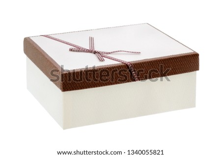 White box with gifts and a brown bow isolated on a white background. Simple white gift box close up isolated. White box with gifts and a brown bow.