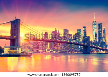 Beautiful sunset over Manhattan with Brooklyn Bridge, New York City