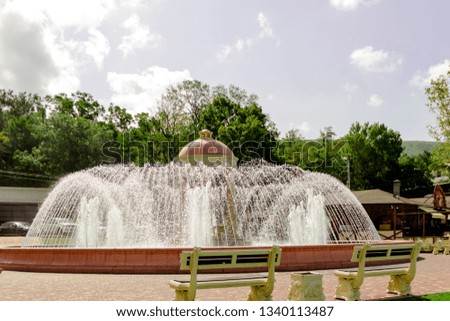 pictured in the photo big beautiful fountain on a bright sunny day
