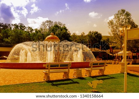 pictured in the photo big beautiful fountain on a bright sunny day