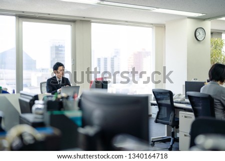 Young manager in office.