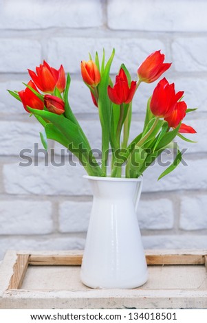 red tulips on the table