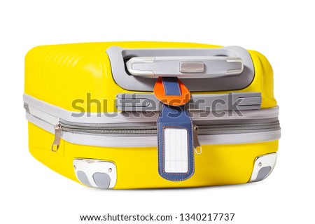 Lost and found baggage concept. Isolated yellow suitcase with empty tag for personal contact information