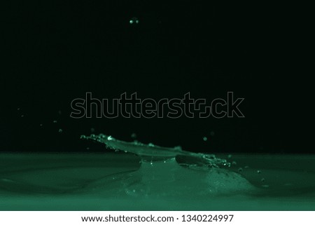 water drop hitting water - splash art