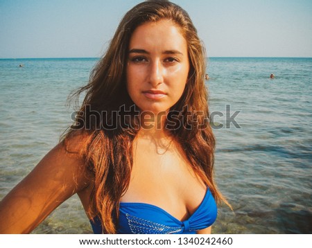Image of plus size young simple latina woman at sea, lifestyle concept. xl model, summer vibes, vintage texture