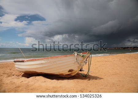 Picture of an old fishing boat on a very cloudy day